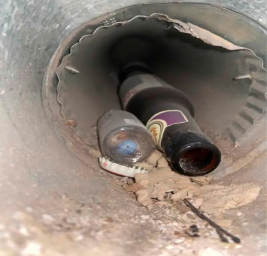 Unusual Blockage Found in Dryer Vent – Littleton Vent Guard A glass bottle and construction debris found blocking a residential dryer vent duct in Littleton, CO.